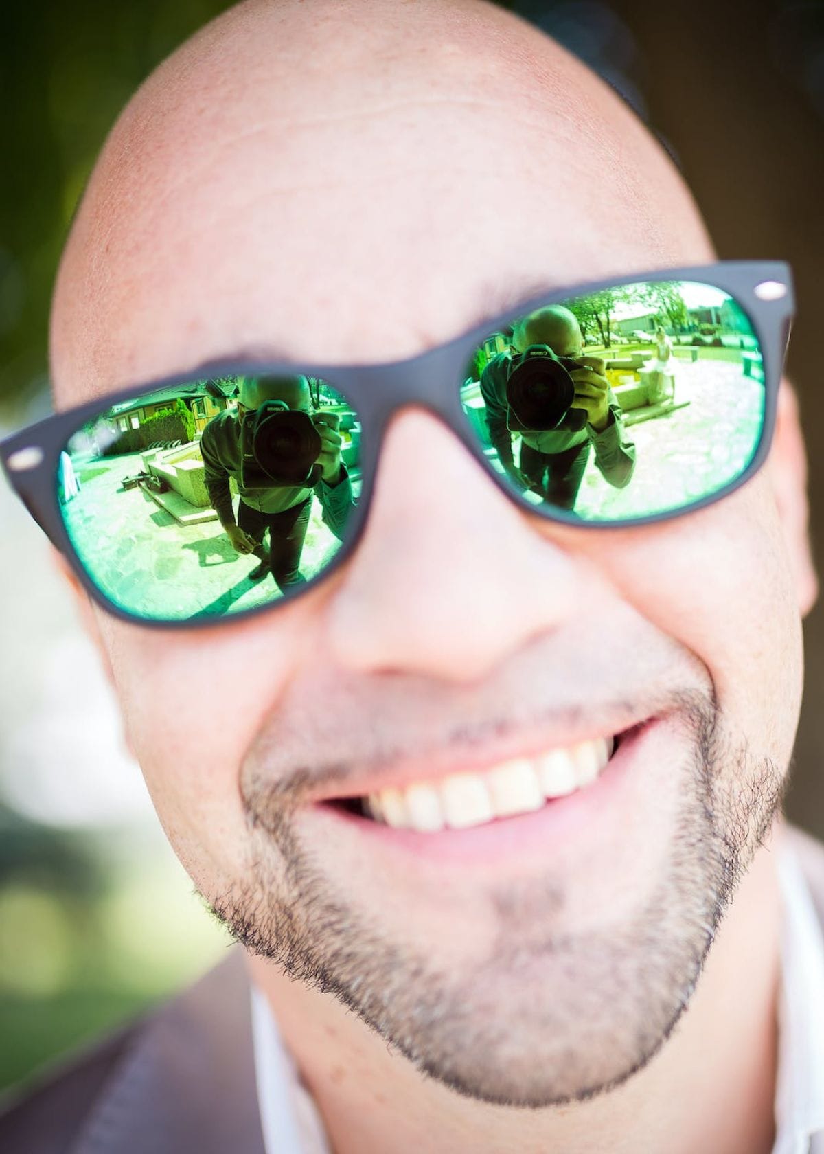 Man with bald head smiling