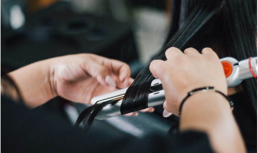 using heat protection spray with a curling iron